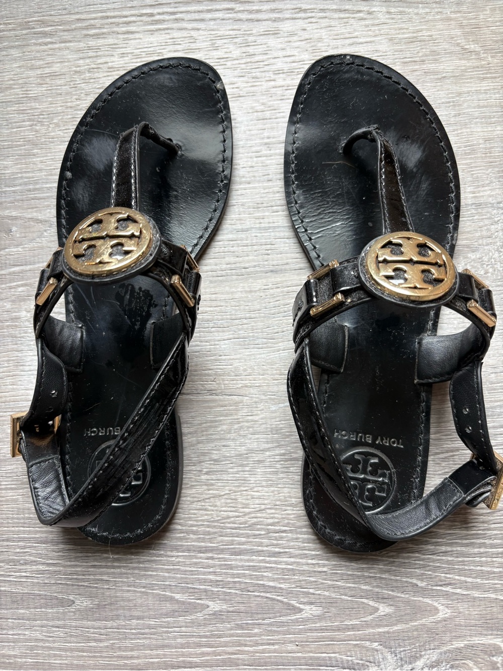 Tory Burch Black Leather Sandals with Gold Logo Medallions